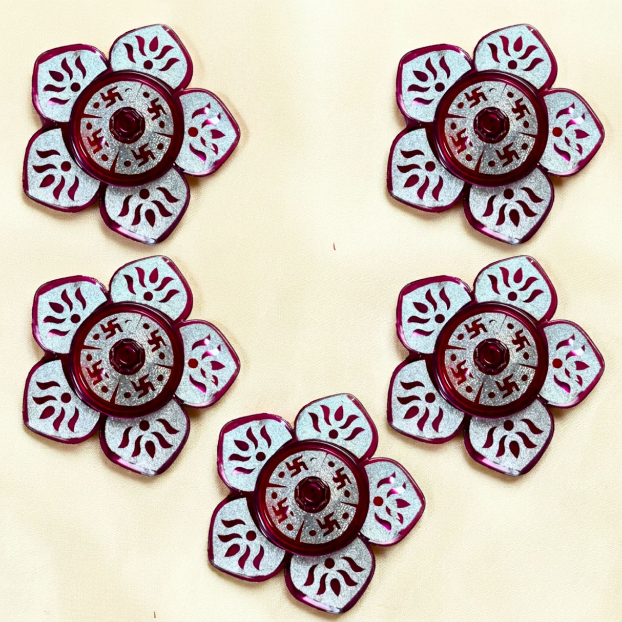 Red and silver floral-shaped decorative buttons with intricate cut-out patterns for lotus haldi kumkum holder pooja favor