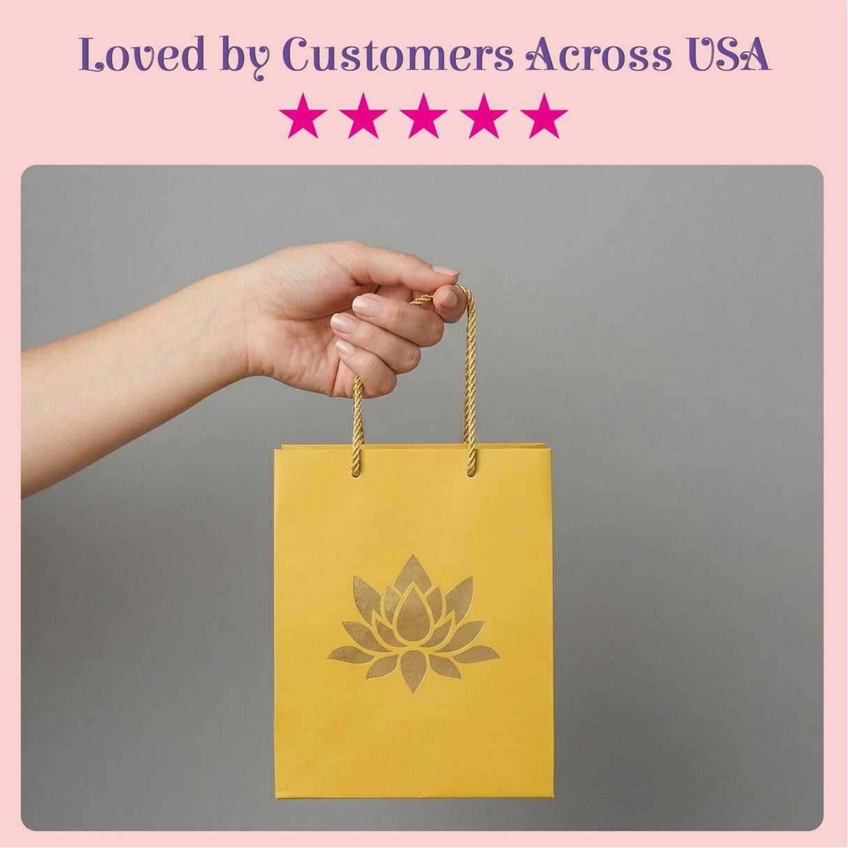 A vibrant yellow lotus paper carry bag with gold rope handles and embossed lotus design for Indian gift occasions