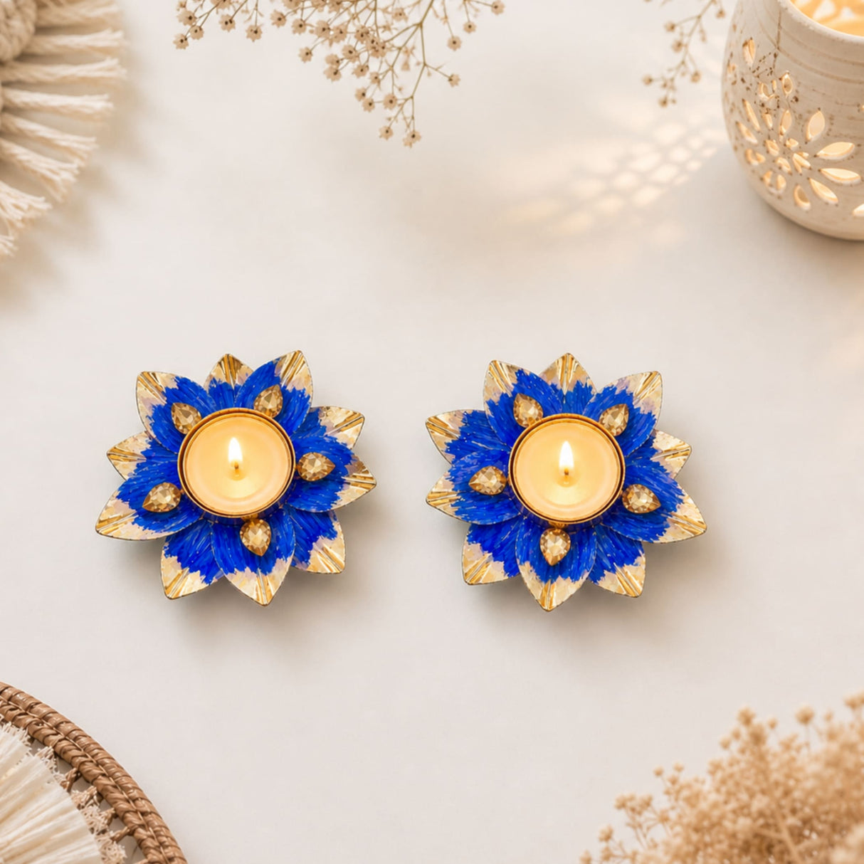 Lotus tealight candle holders in blue and gold with intricate floral petal designs for Diwali pooja and decor