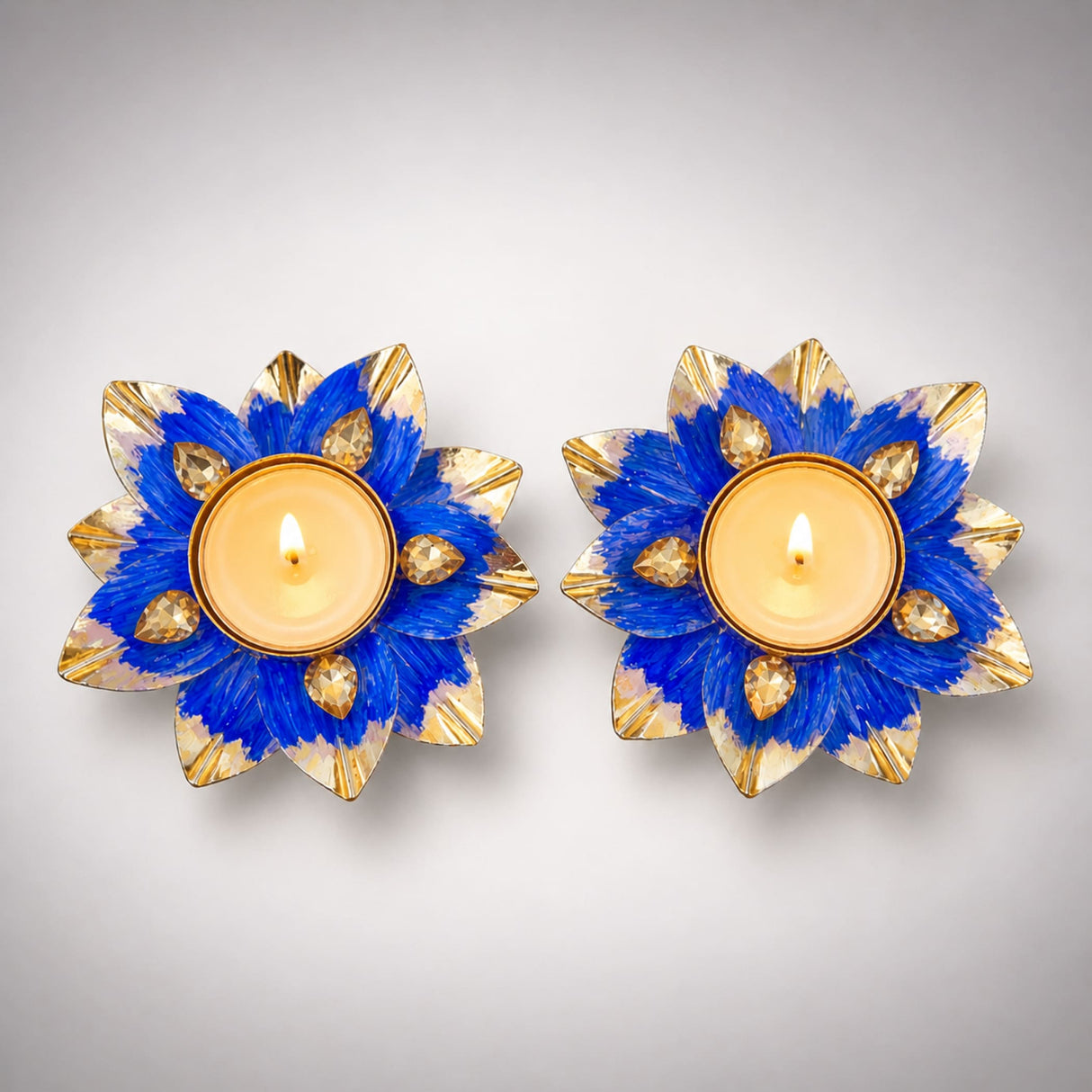 Lotus tealight candle holders in blue and gold with faceted crystal accents for Diwali pooja and home decor