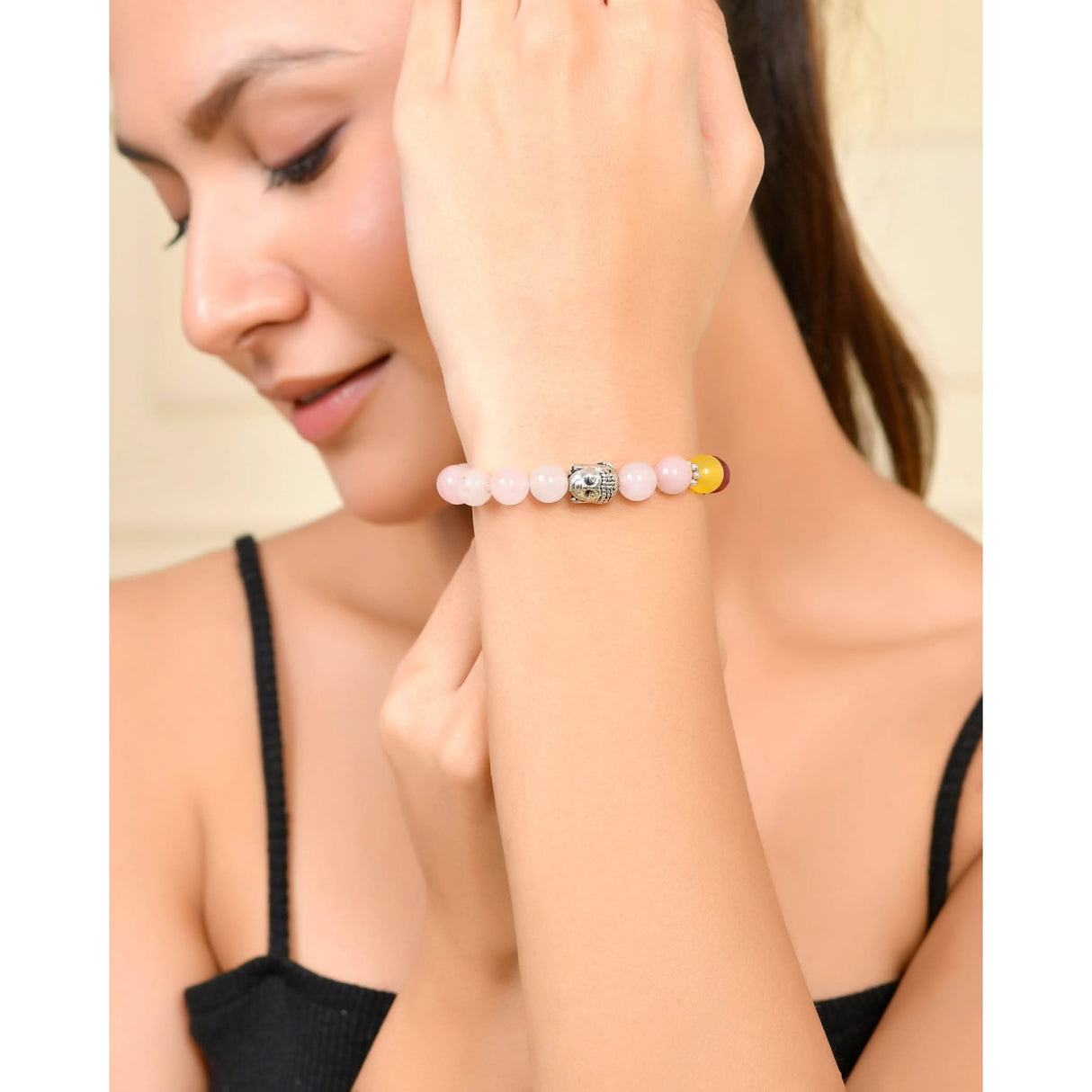 Beaded bracelet with decorative centerpiece from LOVENSPIRE 7 Chakra Rose Quartz collection