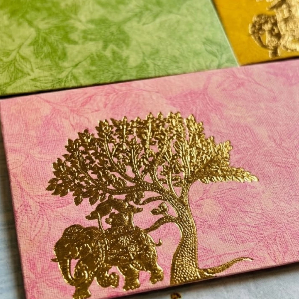 Pink textured money envelope with gold-leafed elephant and tree design for Indian wedding and cash gifting
