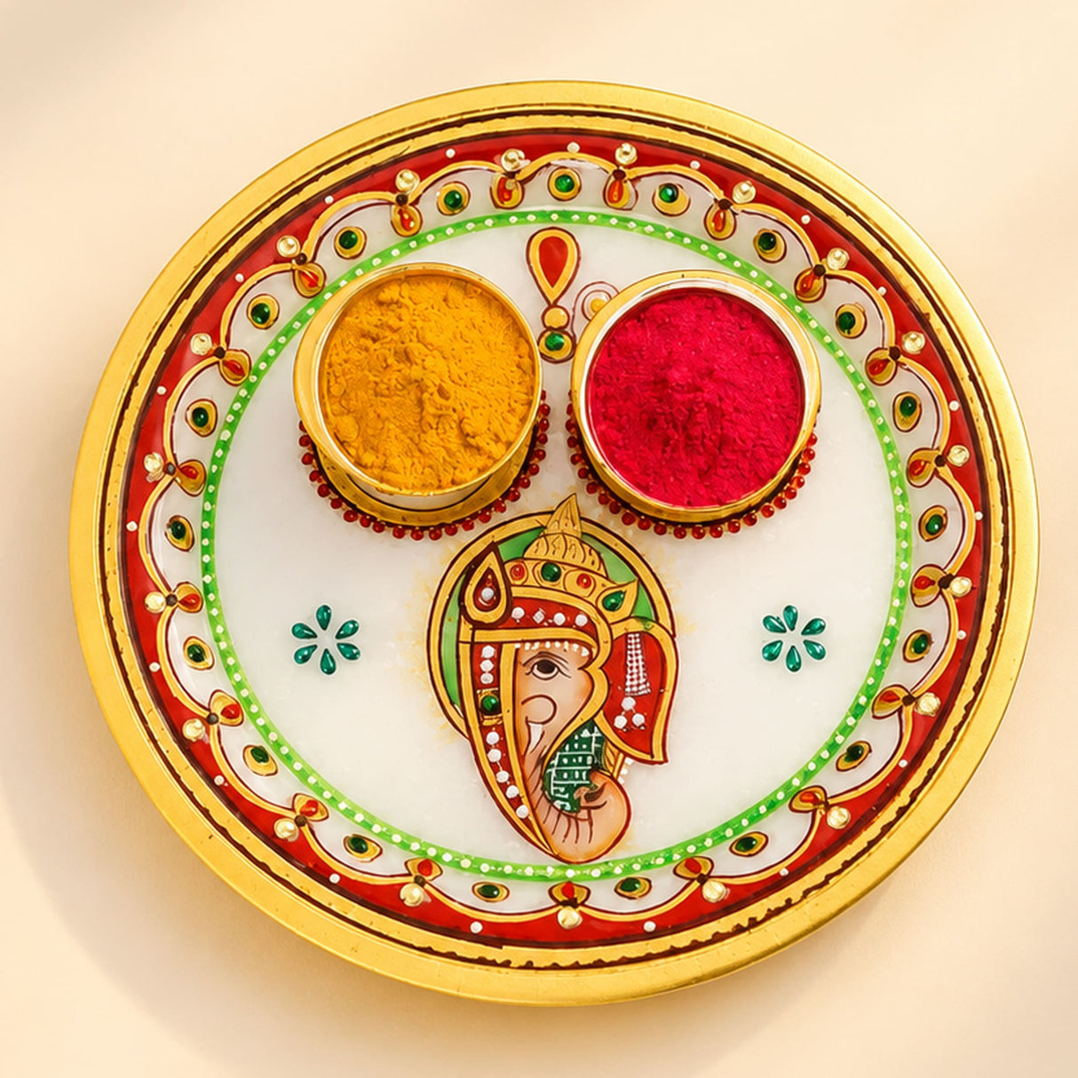 Indian white marble pooja thali with gold rim red and green floral patterns and ganesha design for hindu mandir decor