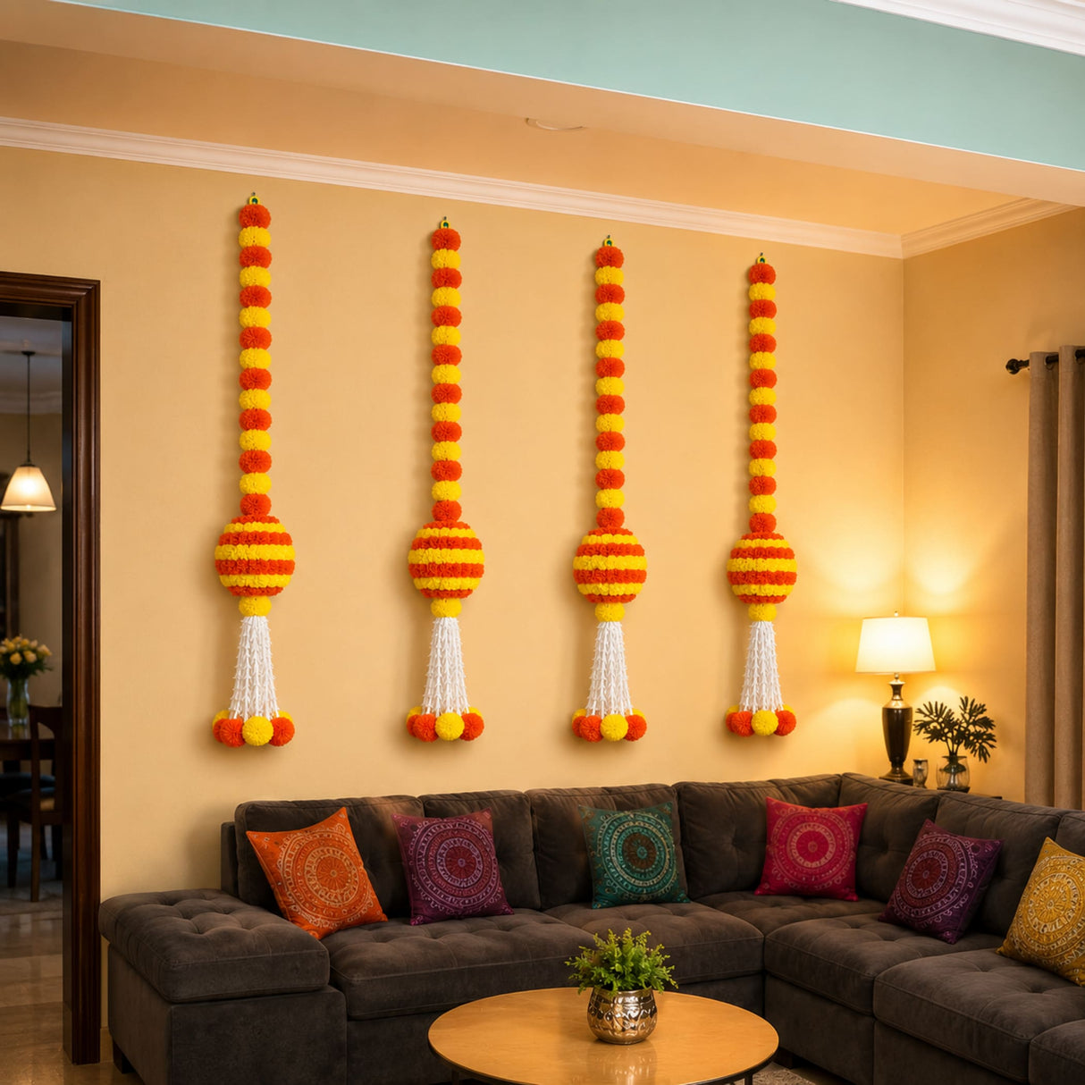Four vertical marigold garland jhoomer hangings in orange yellow with white tassels for indian wedding diwali and fiesta decor