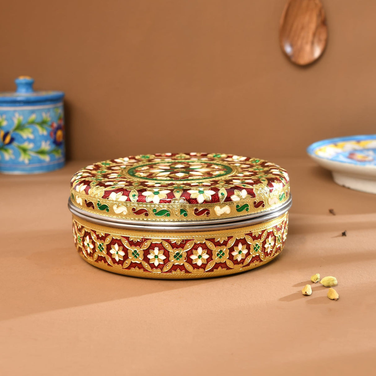 Gold and red floral Meenakari steel round masala box