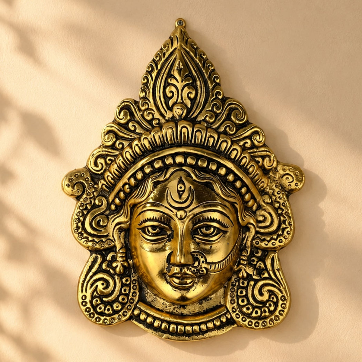 Golden brass metal durga face wall hanging with detailed ornate patterns for home decor puja temple gifts