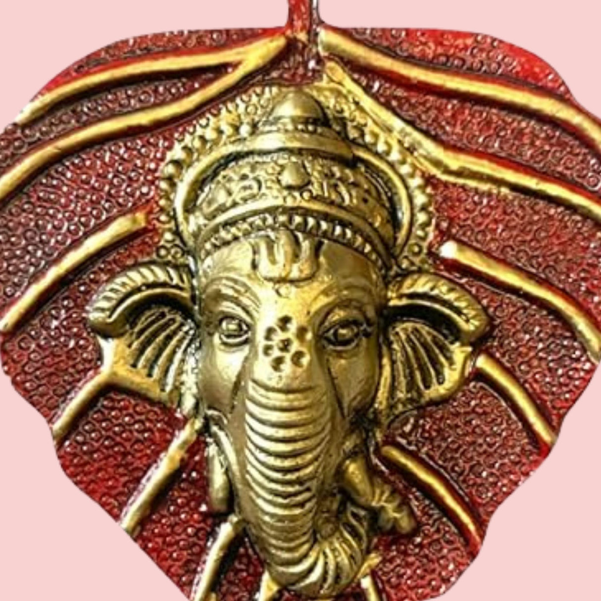 Golden Ganesha pendant on textured red leaf Metal Leaf Ganesha wall hanging
