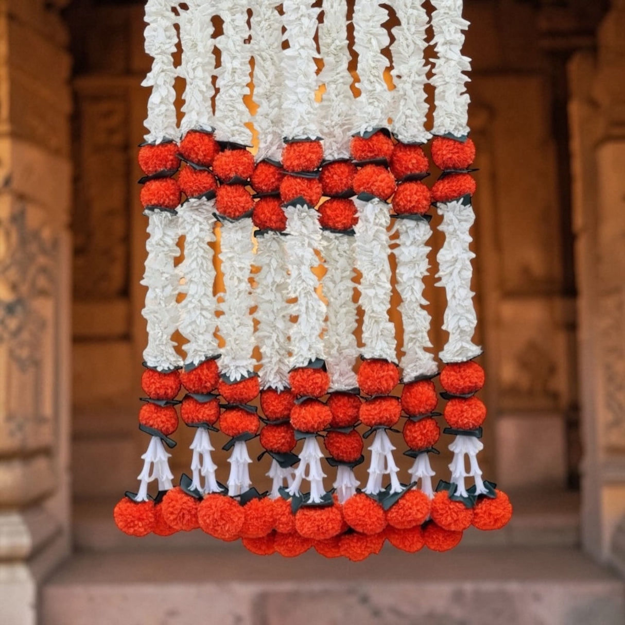 Orange jasmine marigold pom-pom garland for Diwali and wedding decor