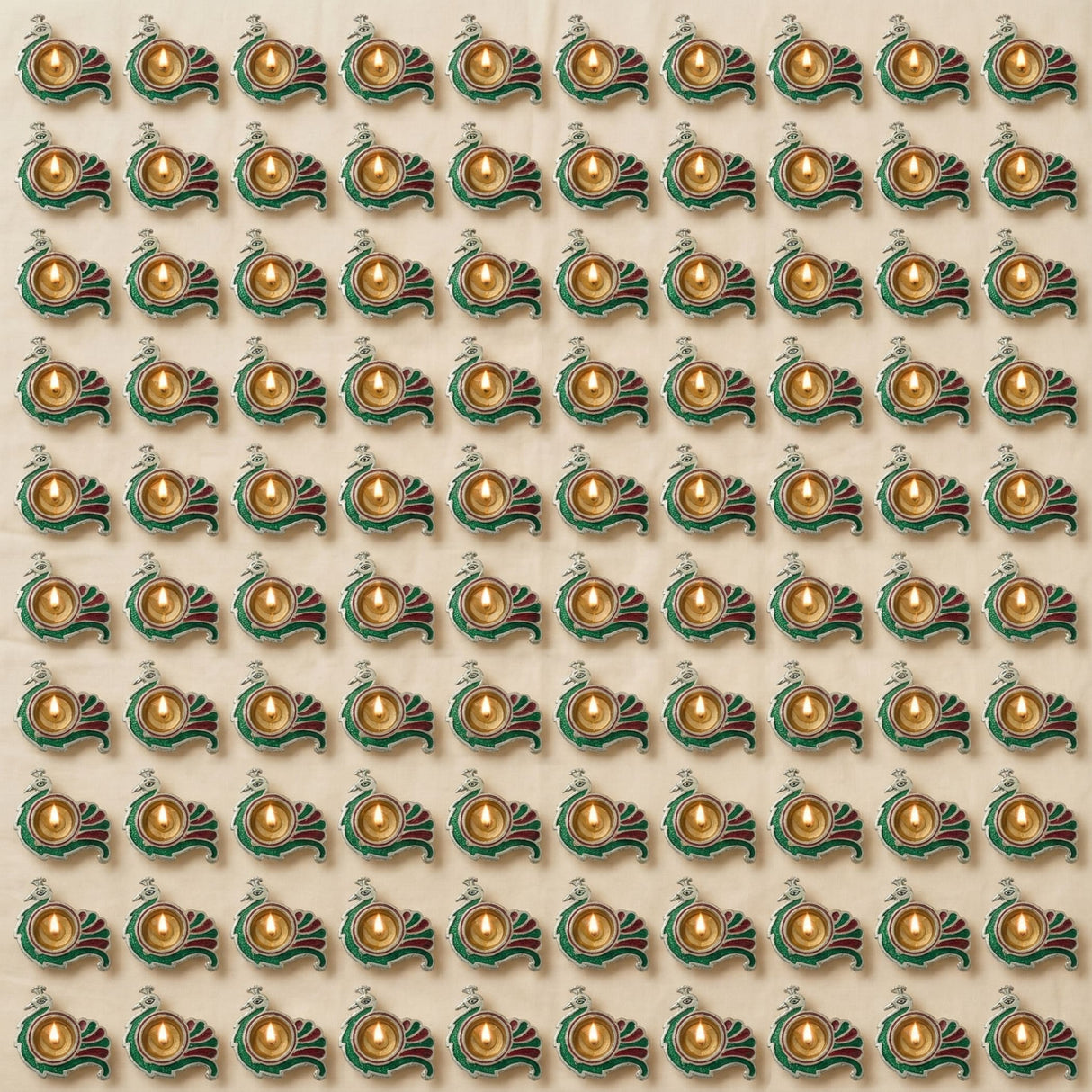 Green and gold peacock-shaped brass finish diya lamps arranged in a grid for diwali and hindu puja decor