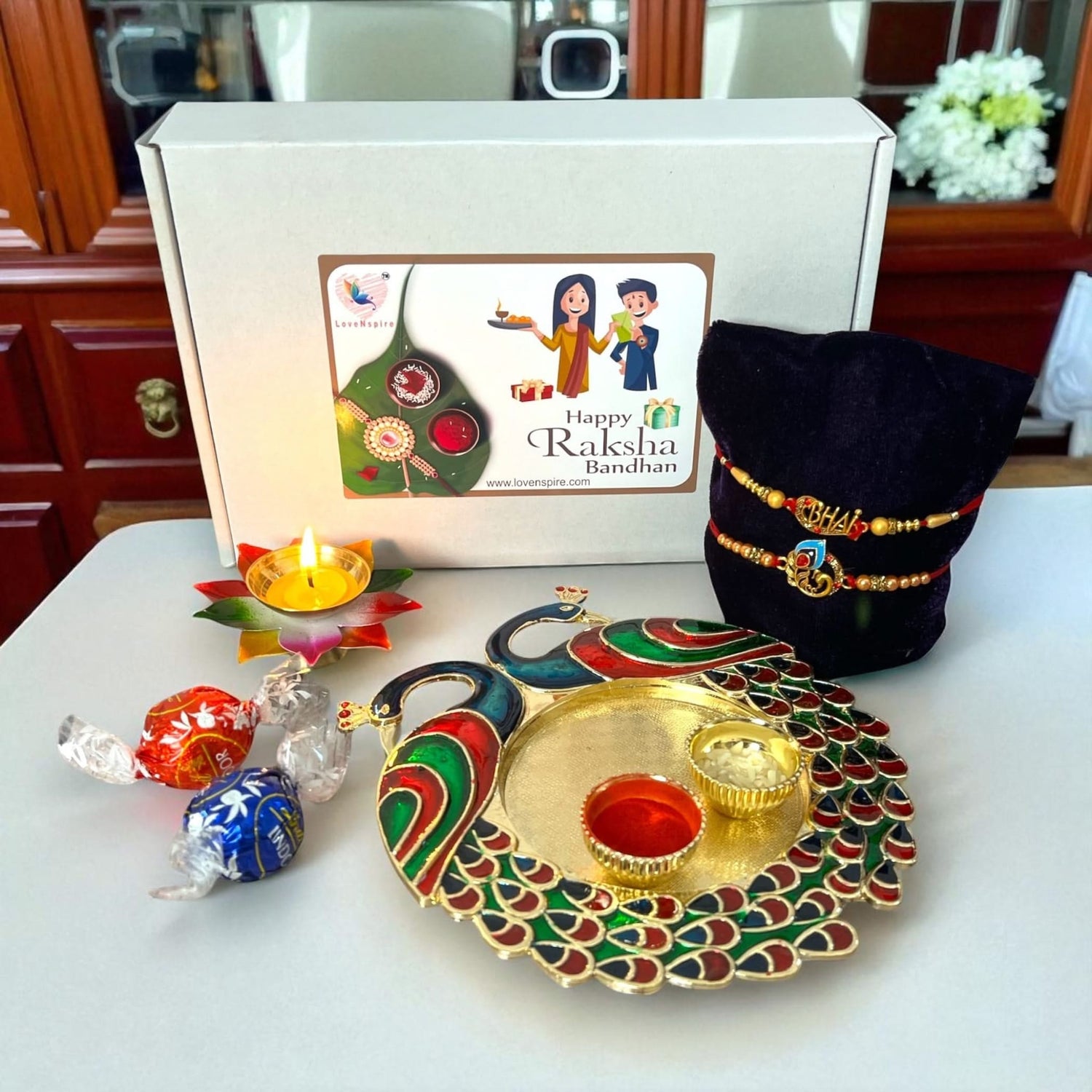 Peacock Rakhi Gift Hamper with Gift Box Set of 2 Rakhi with Traditional Puja Plate Roli Chawal Oil Diya - Raksha Bandhan Bracelet Rakhi for Brother Bhai Bhabhi Sister-In-Law - LoveNspire