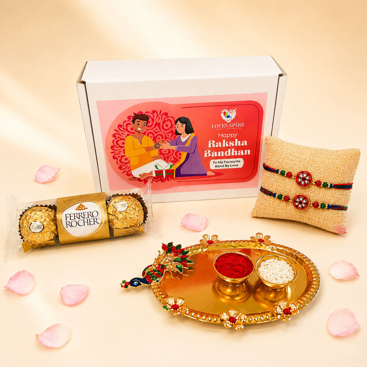 Gold-colored ornate decorative peacock handle tray holding bowls of red powder and white rice in peacock rakhi gift hamper set