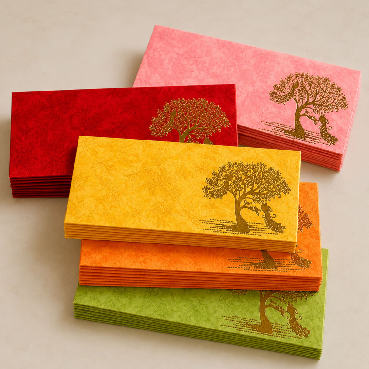 Stacks of vibrant red yellow orange and green paper money envelopes with gold-leaf peacock tree and couple design for weddings and savings