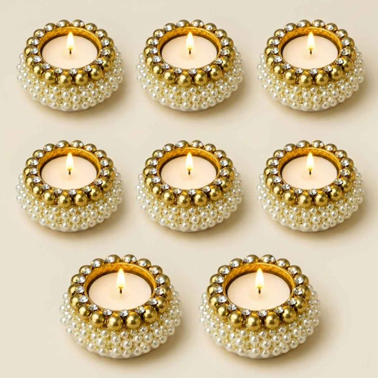 Pearl tealight candle holders adorned with gold and white pearls and sparkling rhinestones for festive home decor