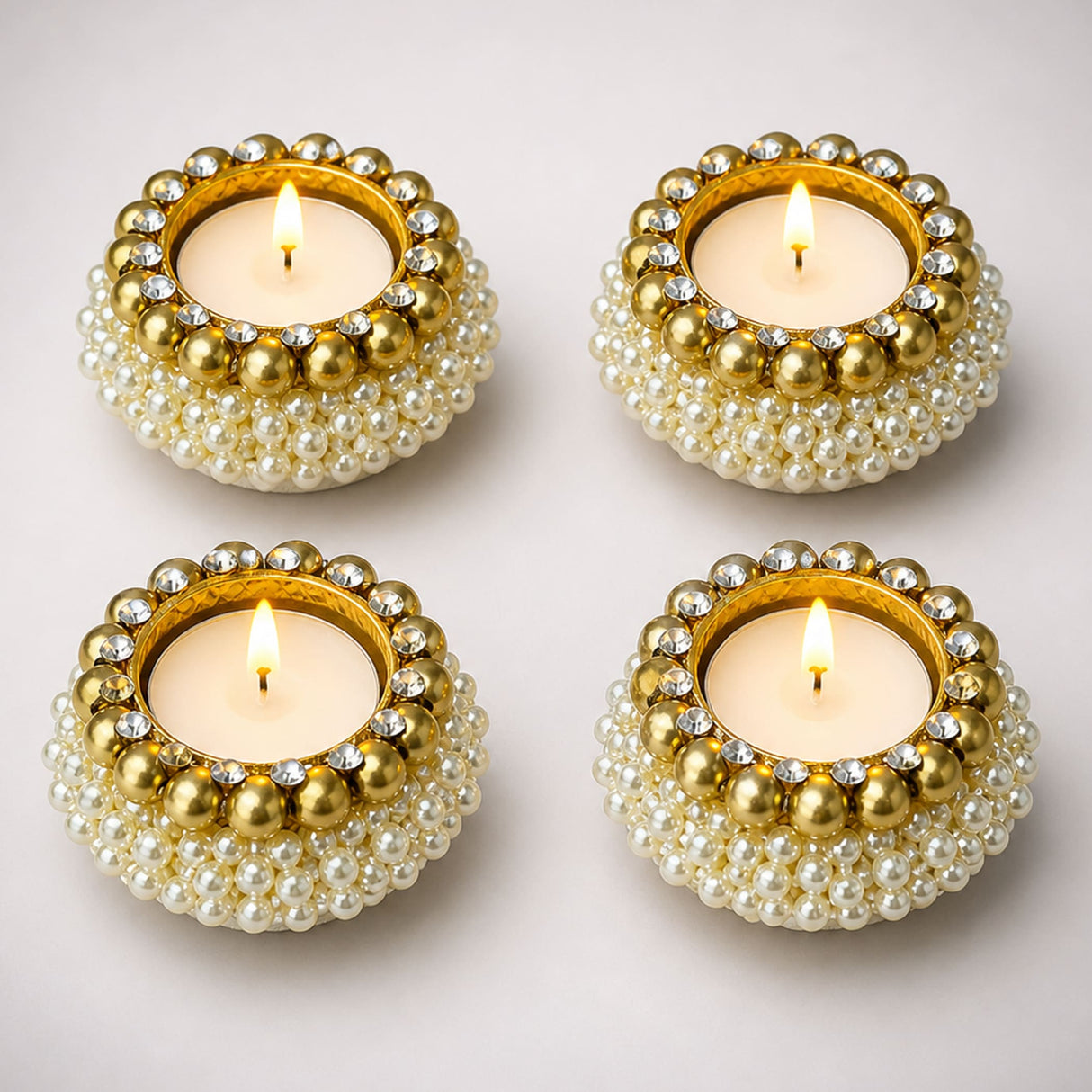 Gold and pearl adorned tealight candle holders with sparkling rhinestones for diwali navratri christmas decor
