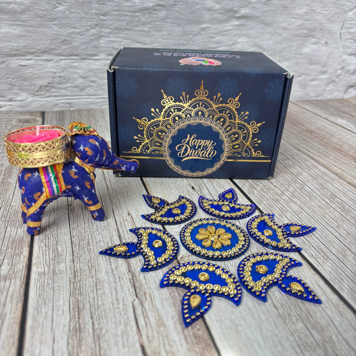 Blue elephant figurine with golden candle holder and decorative Rangoli box for Diwali gift