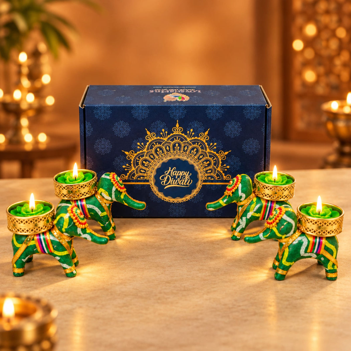 Green and gold elephant-shaped tealight candle holders with intricate patterns in personalized Diwali gifts hamper set