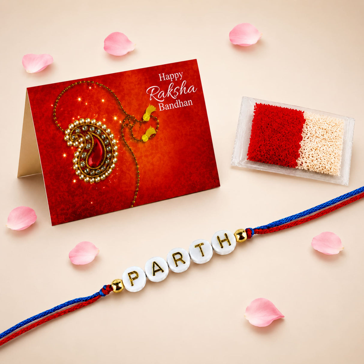 A personalized white bead rakhi with red and blue threads and gold letter beads spelling Parthi for Raksha Bandhan