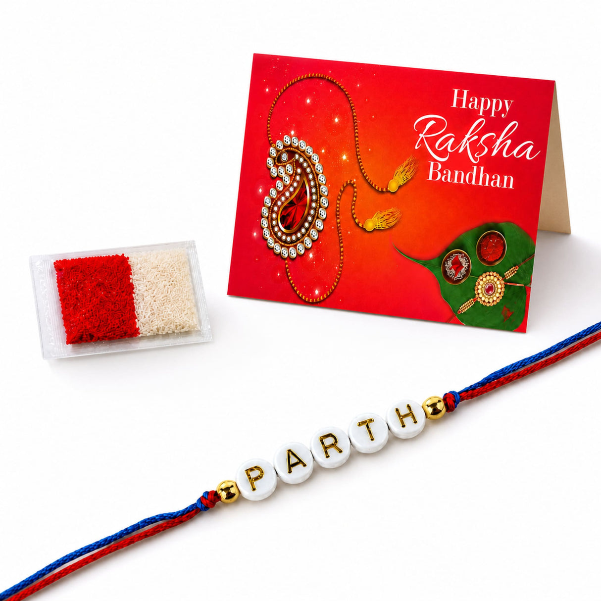 Designer custom named white bead rakhi with gold lettering parth and red and blue cord for brother and bhabhi