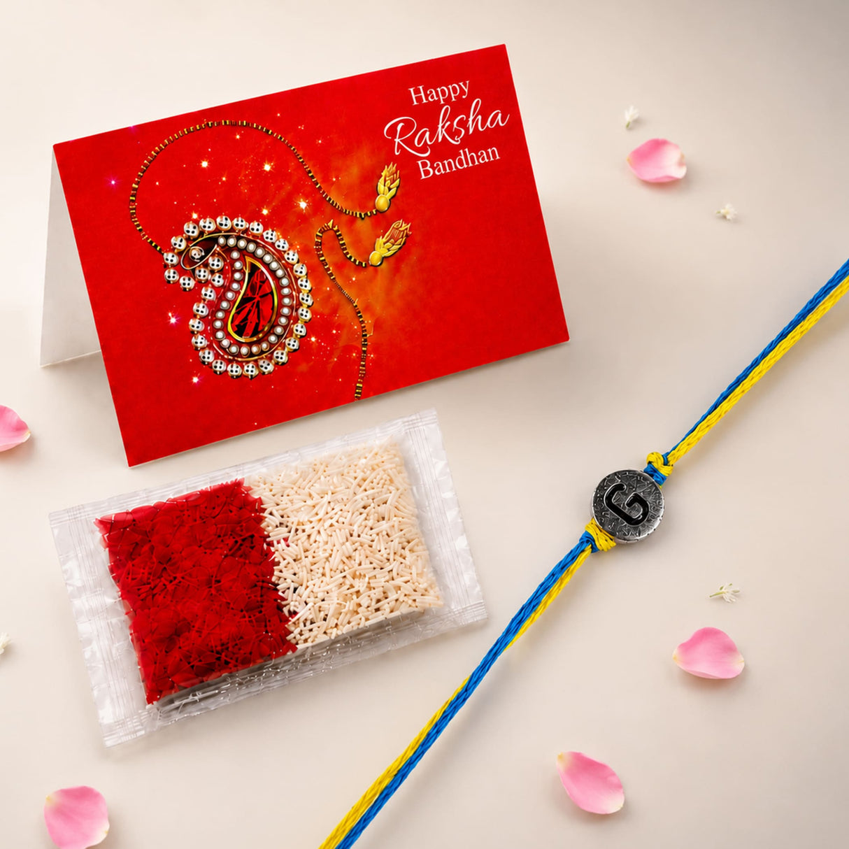 Designer custom single letter rakhi for brother and bhabhi with blue and yellow braided thread and silver circular charm engraved g
