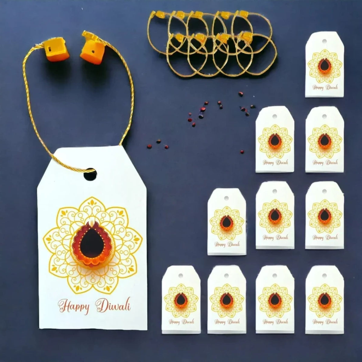 White paper happy diwali gift tag with gold ornate mandala and central orange diya for diwali gifts and party favors