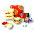 Rakhi gift set with Ganesha Rakhi, candle holder, key chain, chocolates, and gift box