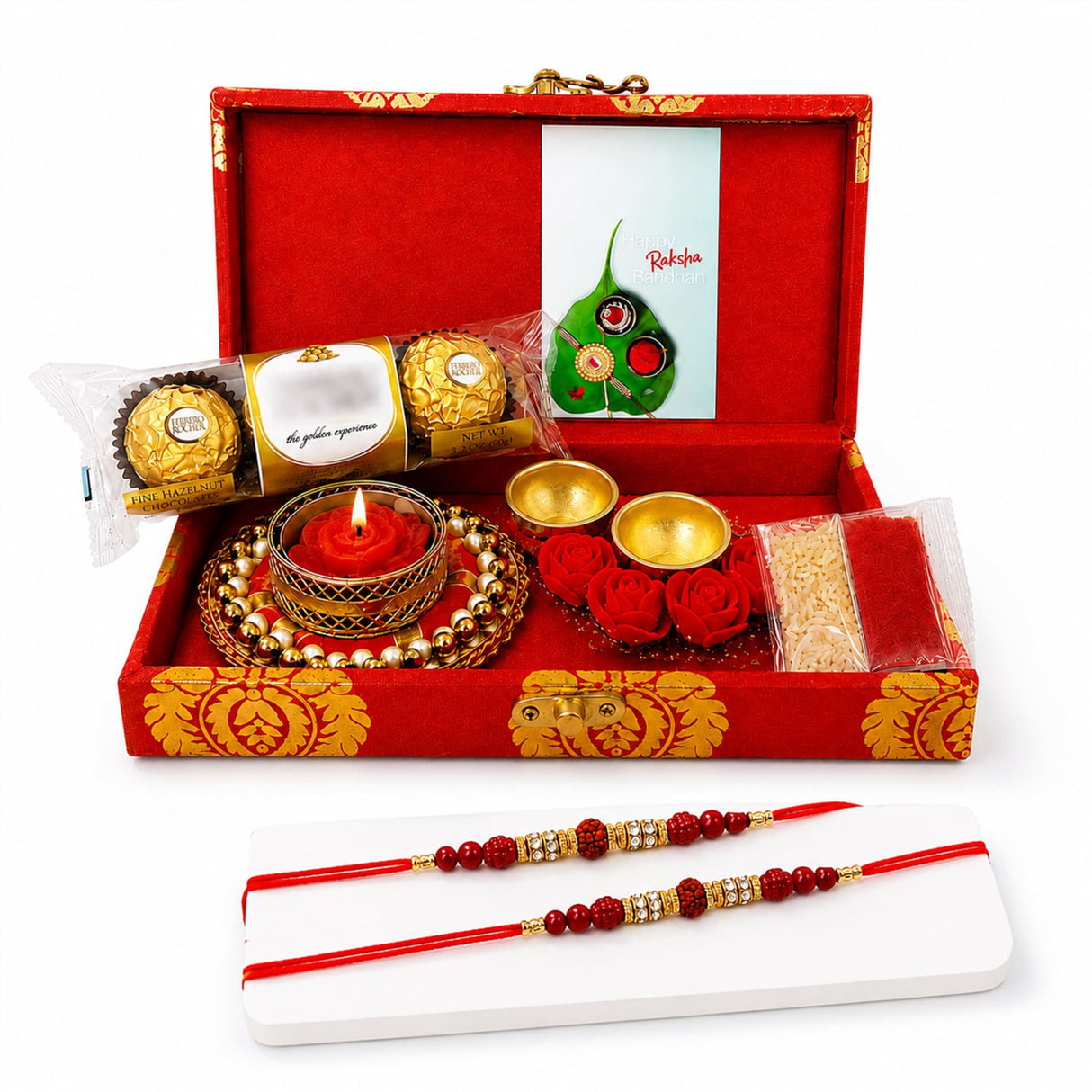 Brocade gift box in red and gold contains two traditional handmade rakhi chocolates candle and decorative items for raksha bandhan