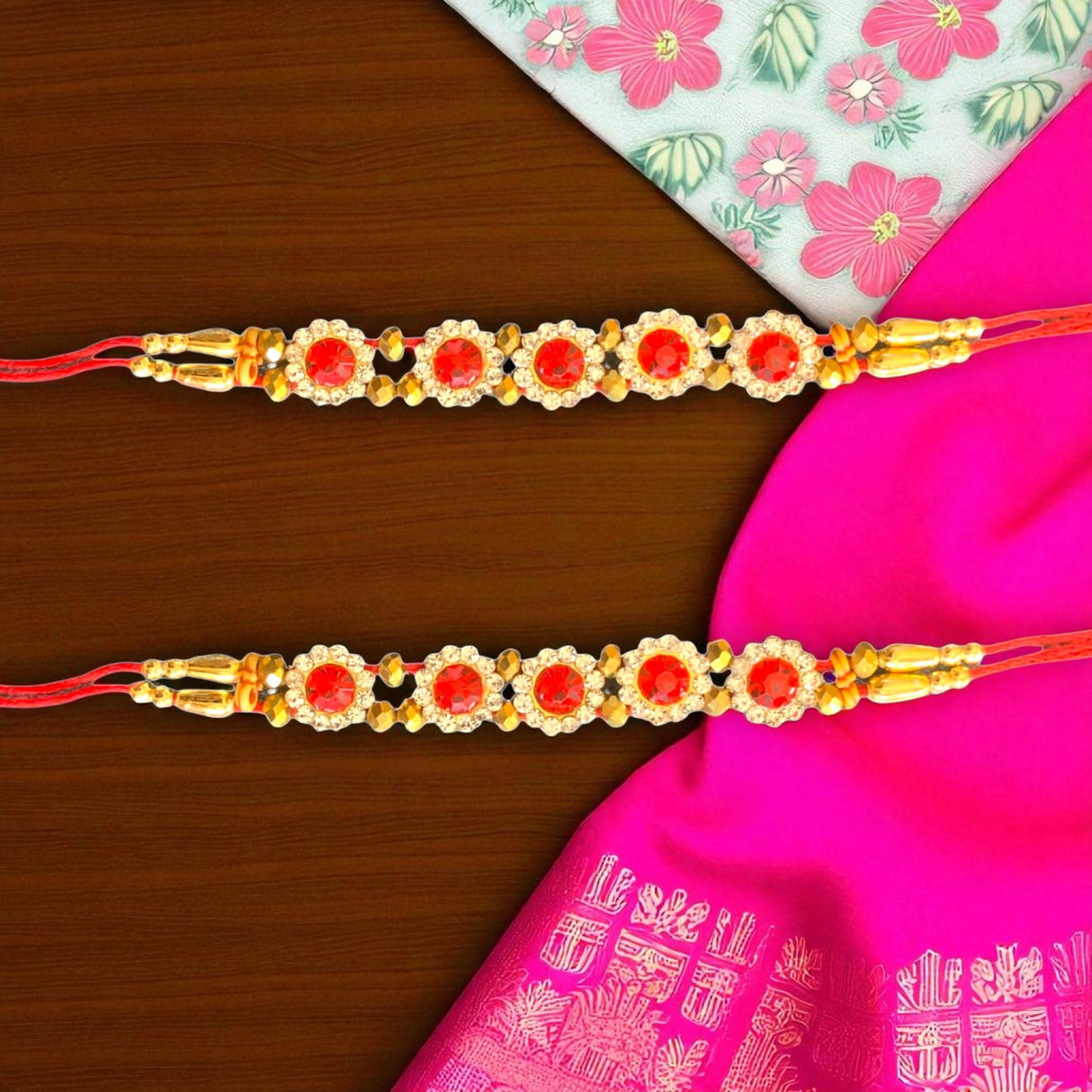 Red and gold Rakhi bracelets included in Rakhi Gift Hamper for Brother with accessories