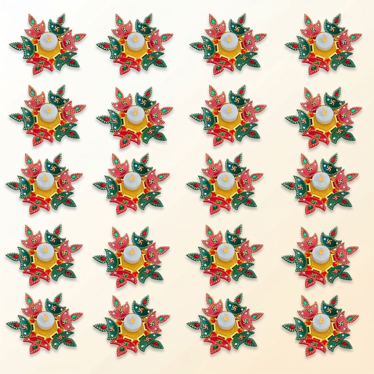 Colorful rangoli diya set with intricately designed red and green leaf patterns and central white tea light candle for diwali decor