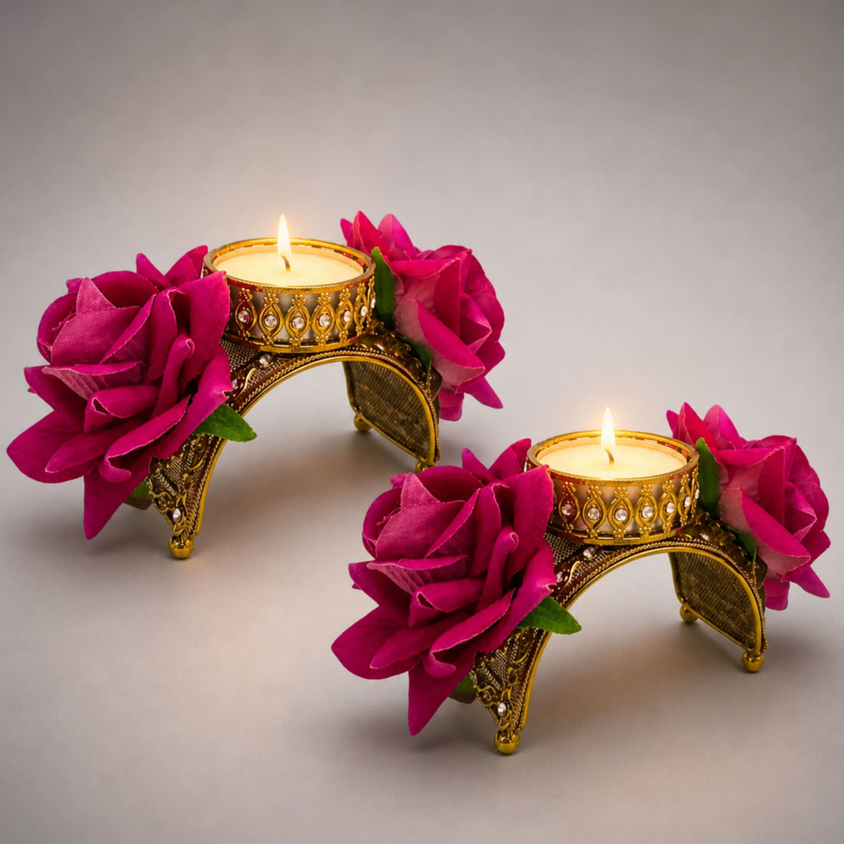 Golden ornate tealight candle holder with fuchsia artificial roses and gemstone accents for festive home decor