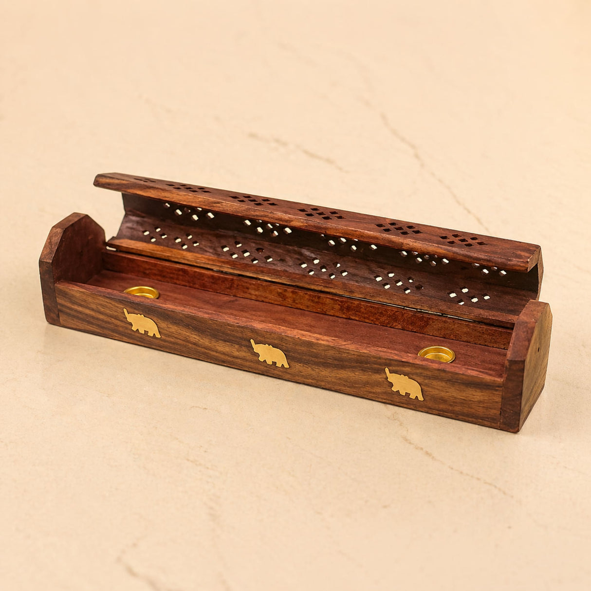 Rich brown rosewood incense stick holder with gold elephant inlays and perforated lid for temple decor and fragrance burning