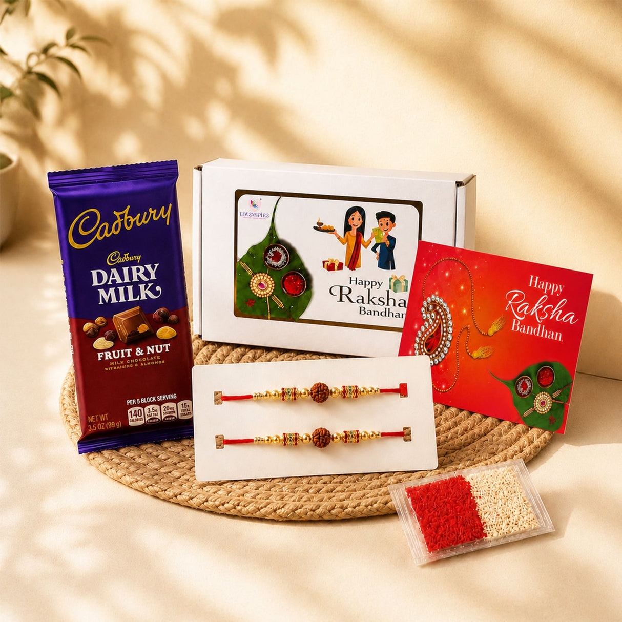 A vibrant red and gold raksha bandhan gift hamper with handmade rudraksha bead rakhi bracelets greeting card and chocolate