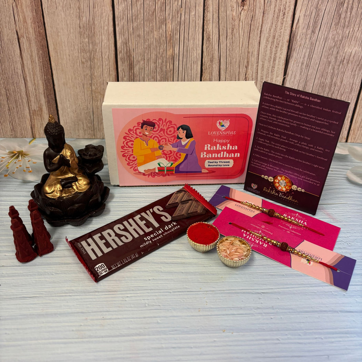 Raksha Bandhan Gift Hamper for Brother & Bhabhi – Includes 2 Rudraksha Rakhi Bracelets, Buddha Dhoop Burner, Dhoop Sticks, Chocolates, Roli Chawal & Gift Box
