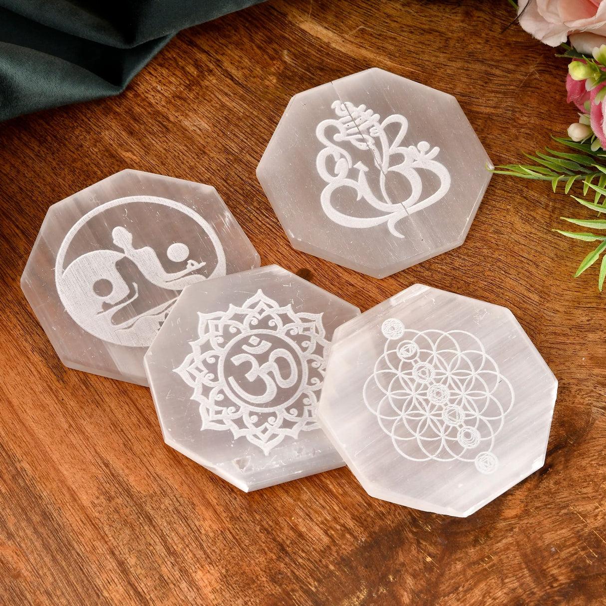 Octagonal Selenite crystal coasters with engraved symbols for crystal charging and decor