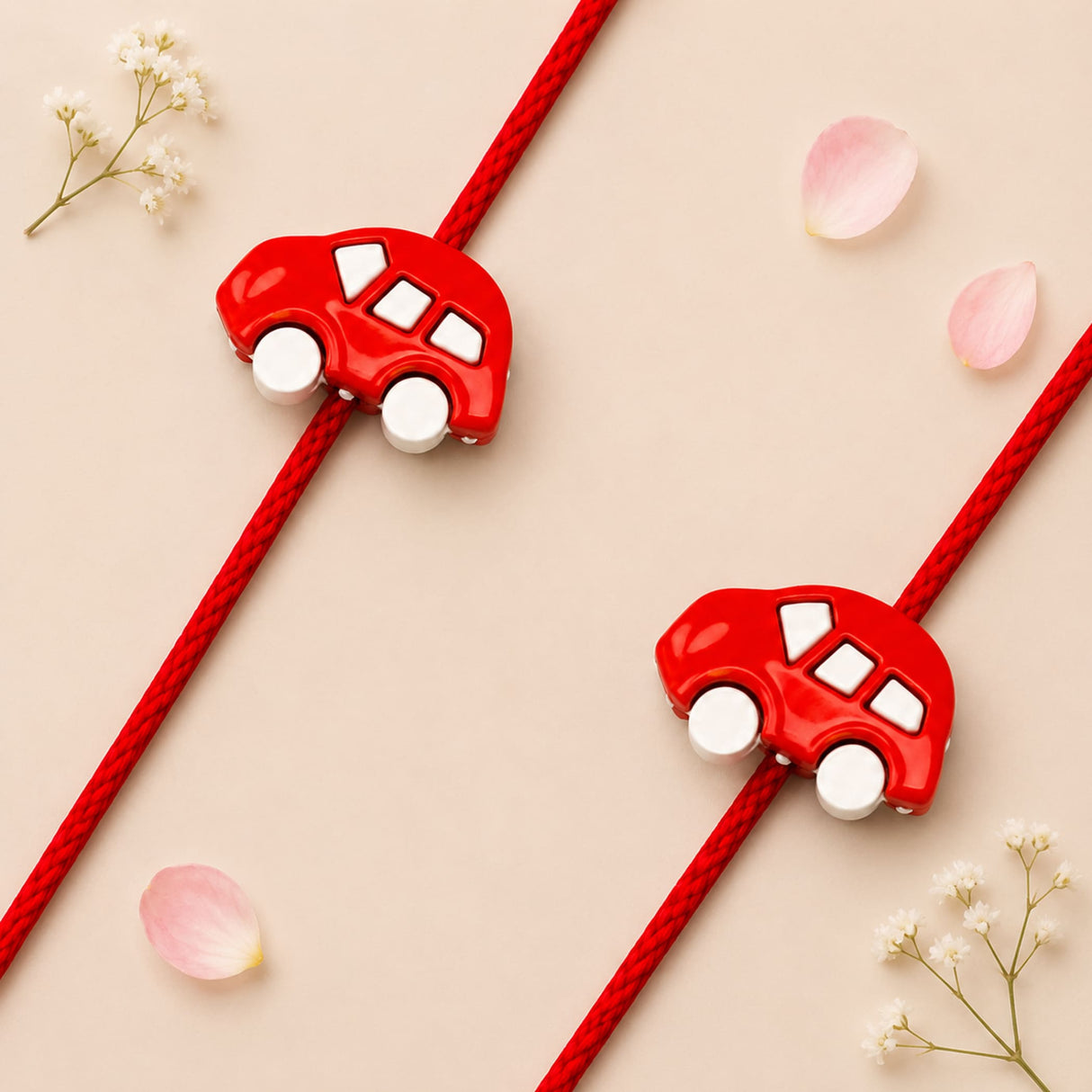 Red toy car charm with white windows and wheels attached to a red cord in cute cartoon car rakhi bracelet for brother