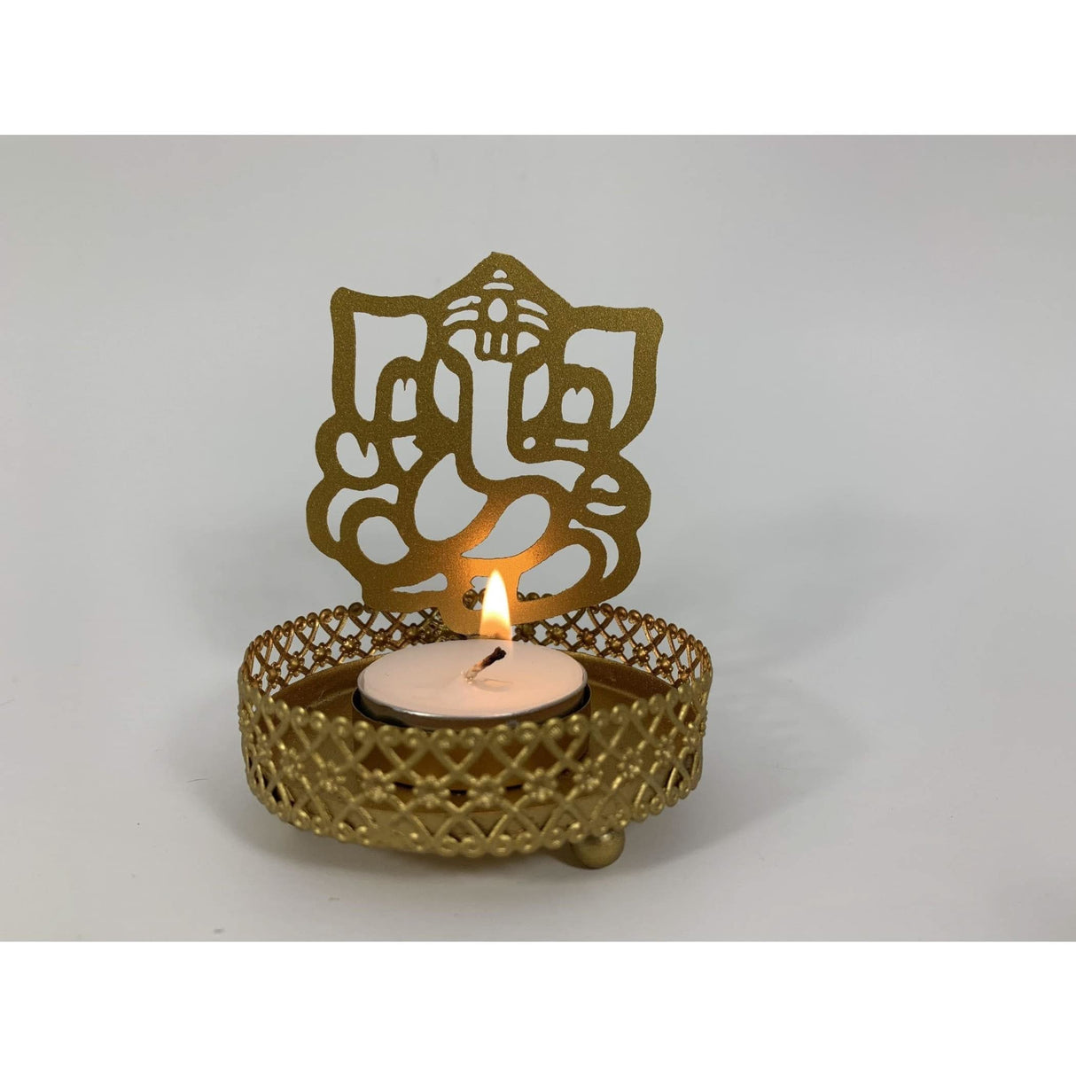 Gold-colored Ganesha tea light holder with lit candle for Diwali and festive occasions