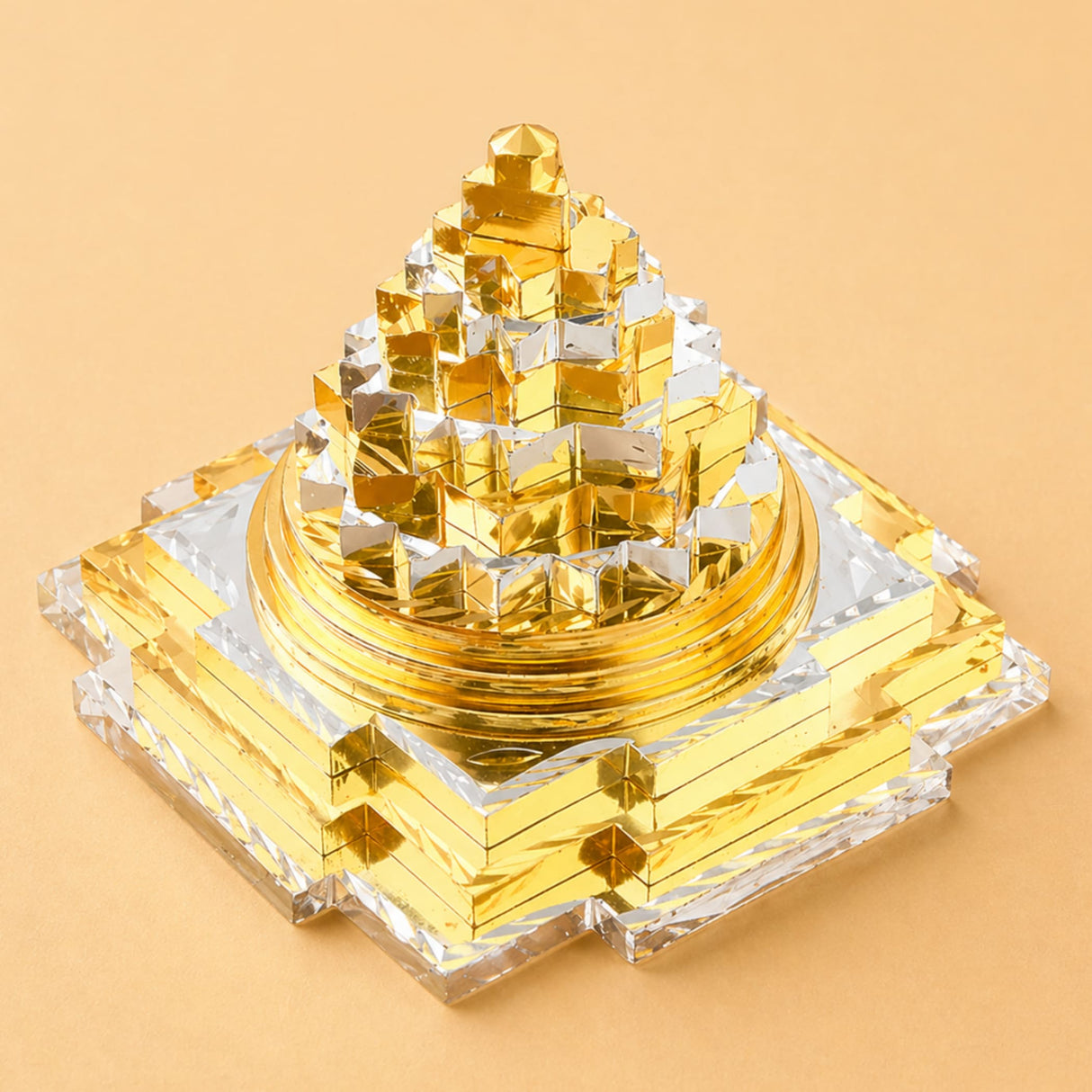 Golden and silver metallic sri yantra pyramid sculpture made of brass for good luck wealth and spiritual meditation decor