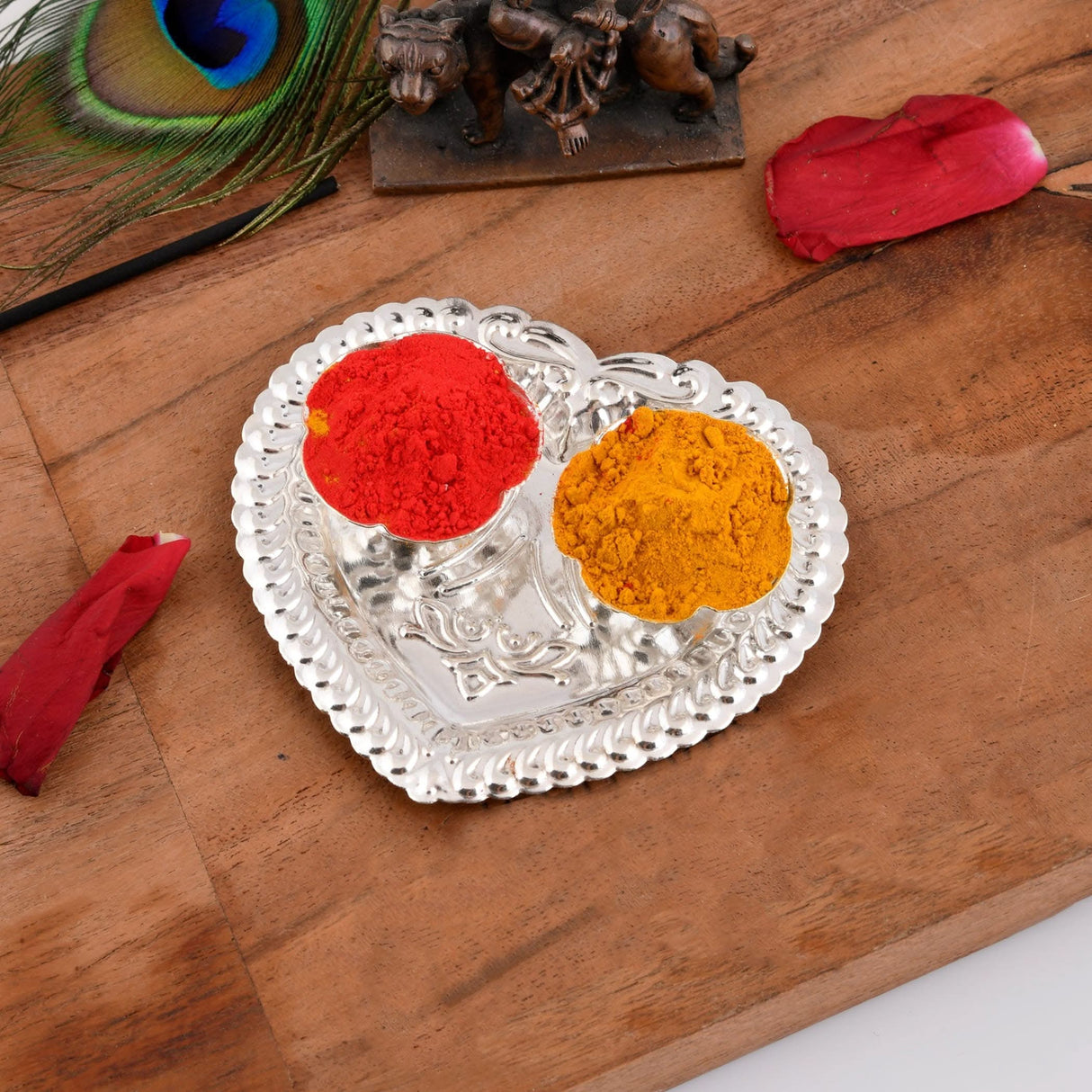 Heart-shaped silver plated Haldi Kumkum holder with red and yellow powders for Indian festivals