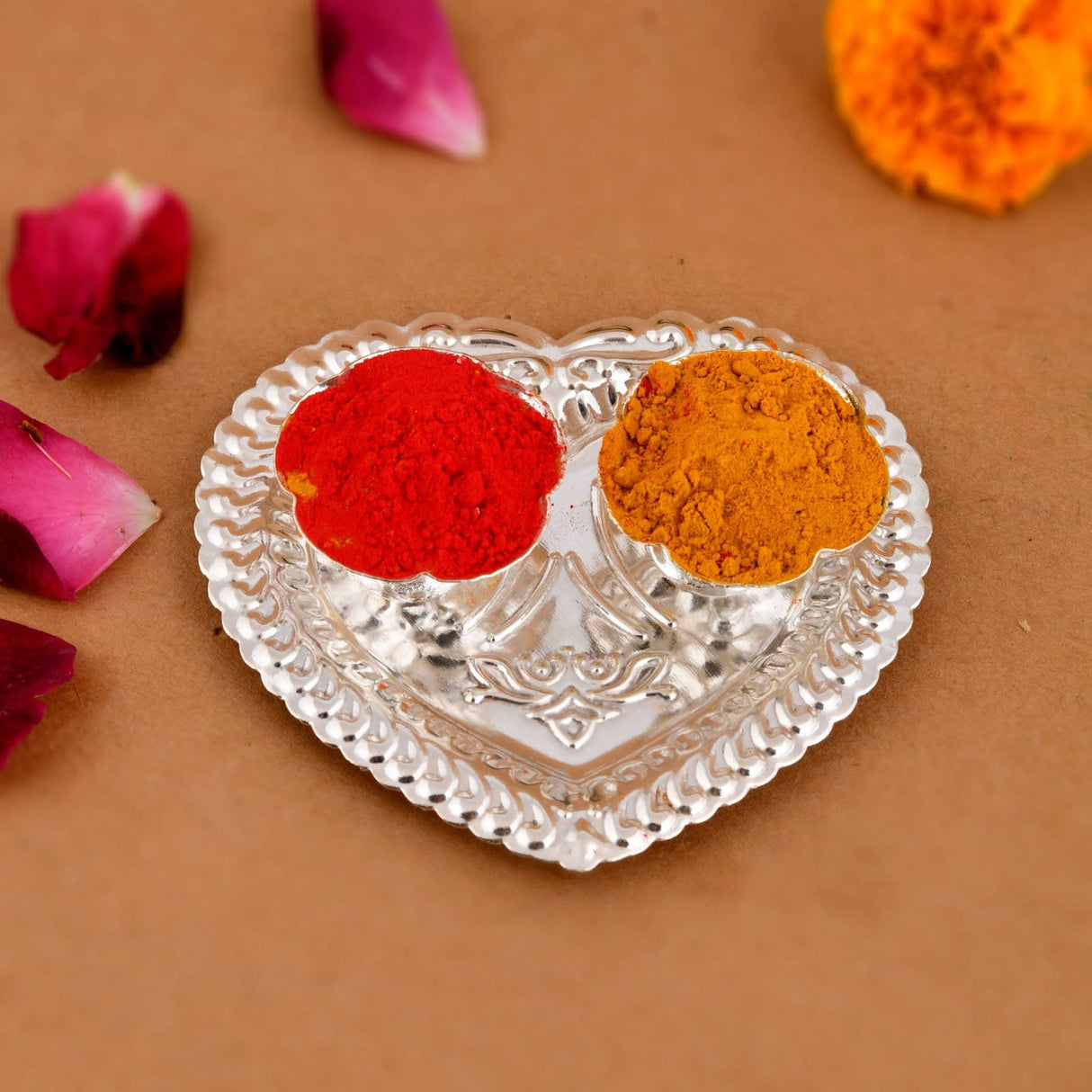 Silver heart-shaped plate with red and yellow powders for Home Temple Decor and Gifts