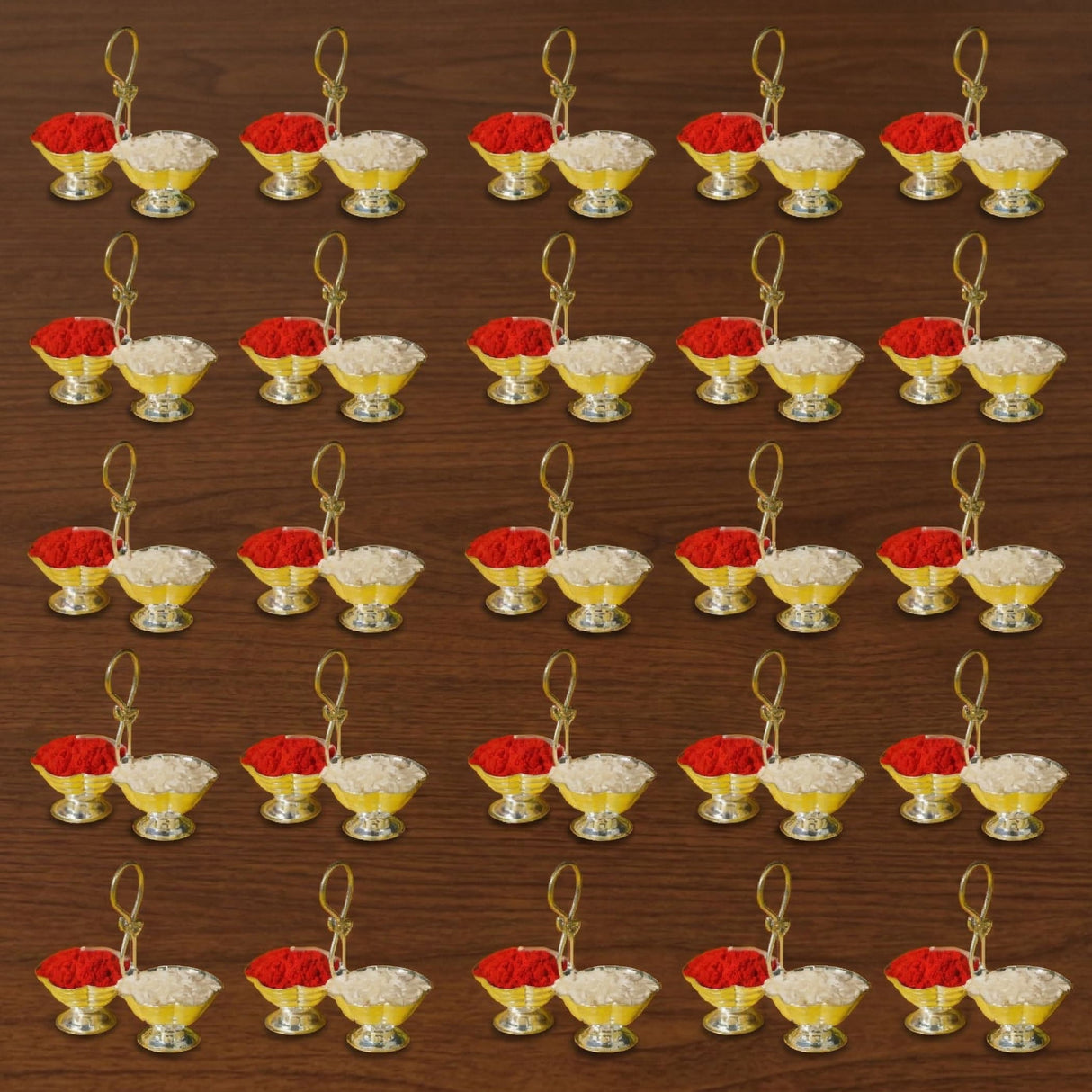 Silver plated haldi kumkum holder with gold-colored twin bowls containing red and white powders for Indian festival puja