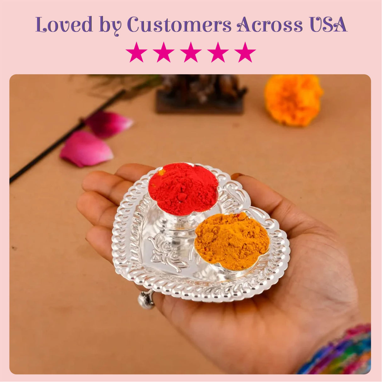 Silver plated heart shaped haldi kumkum holder with two compartments containing red and orange powders for puja decor
