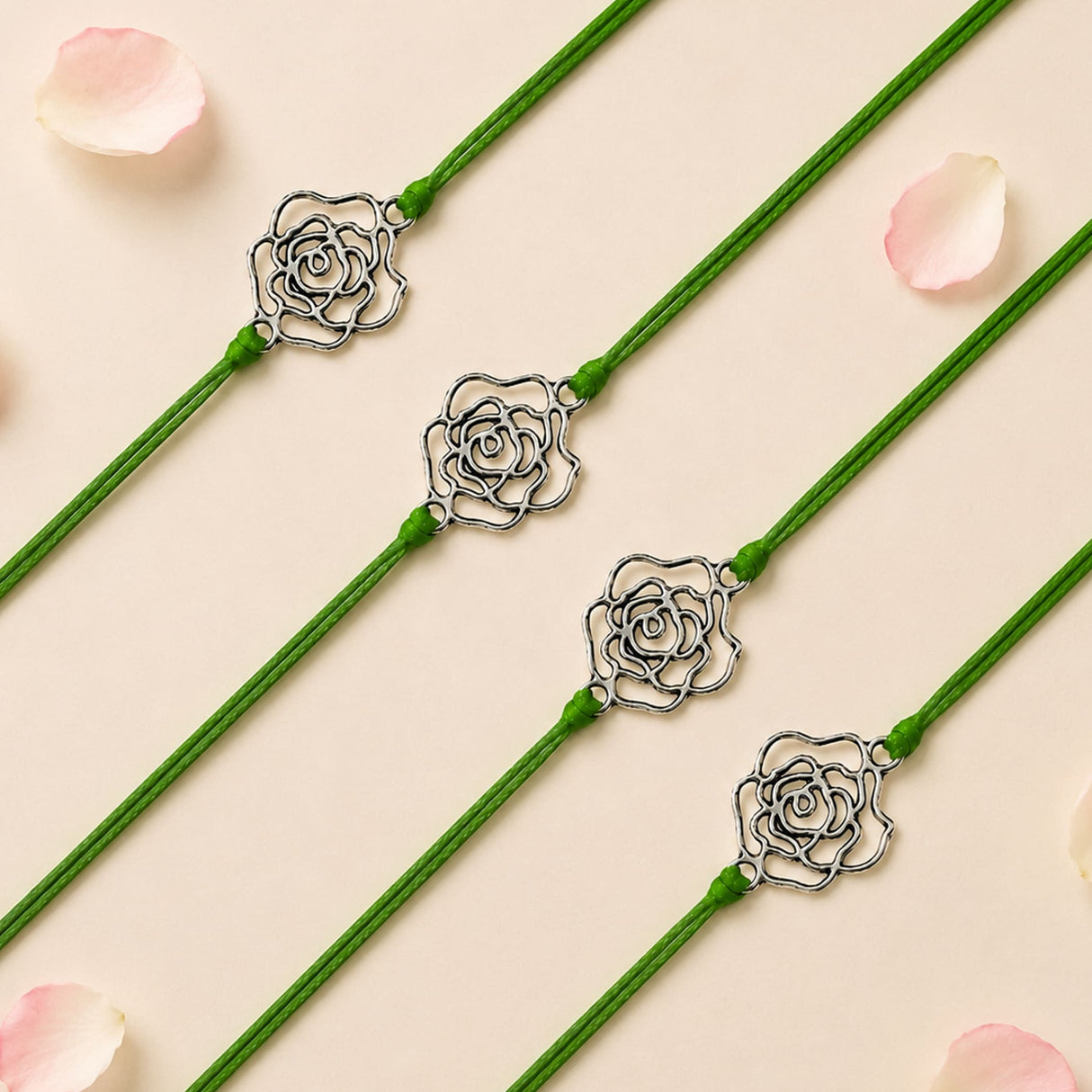 Green cord bracelet with a delicate silver toned rose charm for raksha bandhan protection and good luck gift