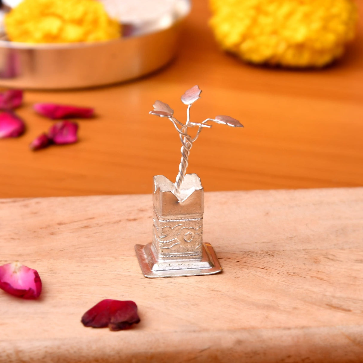 Silver plated miniature tulsi plant figurine with intricate leaf details on square engraved base for pooja decor and gifts