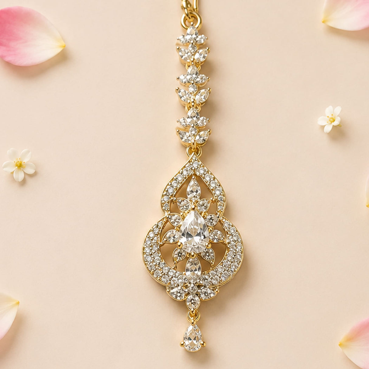 Gold-plated 1 ct small American diamond maang tikka with pear-shaped crystal and intricate floral design for Indian jewelry