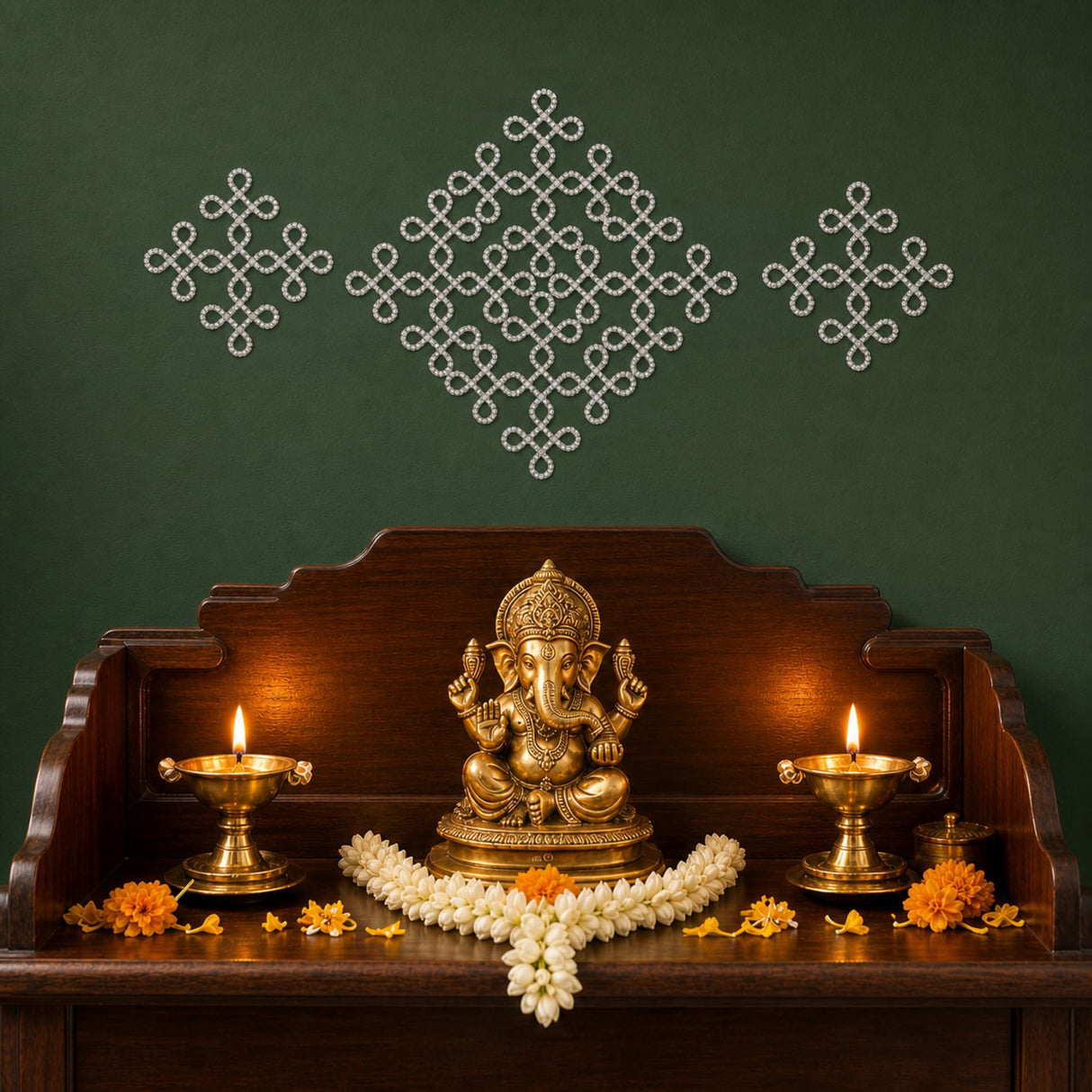 Golden brass ganesha statue seated on pedestal with intricate carvings and jasmine flowers for puja mandir decor