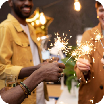 Sparklers being held during a celebration.