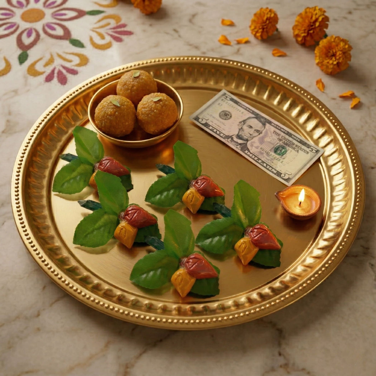 Golden ornate serving tray with decorative rim and textured surface for haldi kumkum packets in indian wedding set