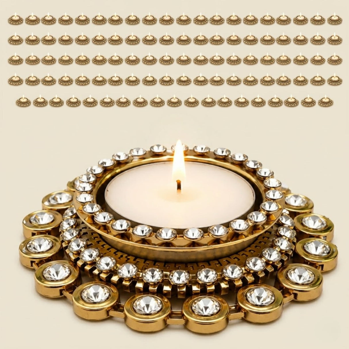 Gold-colored ornate tea light candle holder diya with clear crystal embellishments for Diwali and festive home decor