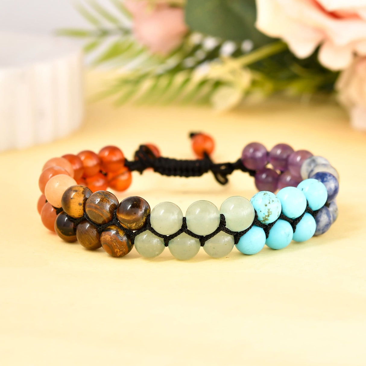 Colorful beaded chakra bracelet made of Tiger’s Eye for meditation and healing