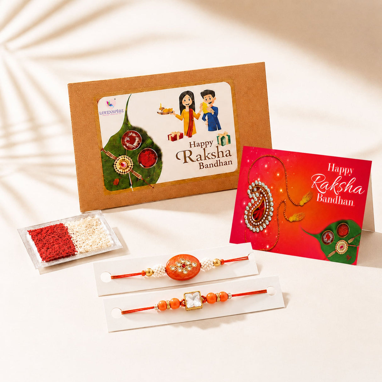 Traditional lumba rakhi set featuring orange beaded rakhi with ornate circular pendant and gold tone accents for brother and bhabhi