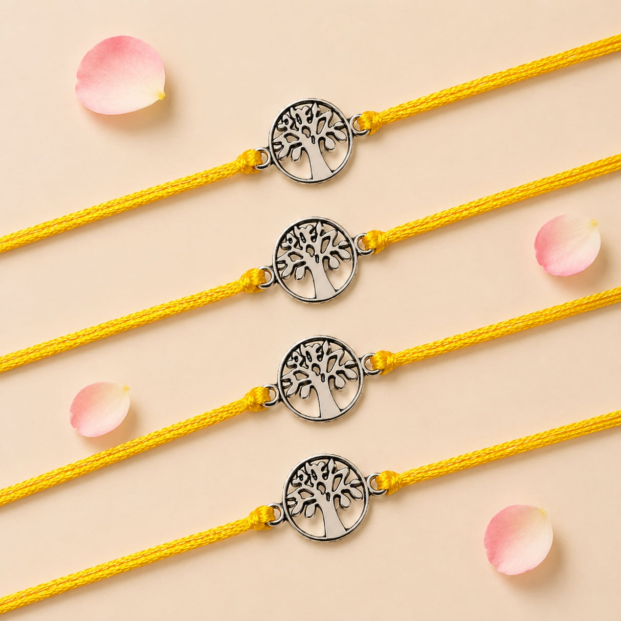 Four silver tree of life charm bracelets on vibrant yellow cords for traditional raksha bandhan gifts of protection and luck